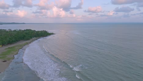 Aerial-flyover-beach-and-shoreline-of-Miches-in-El-Seibo-Province-during-sunset-time