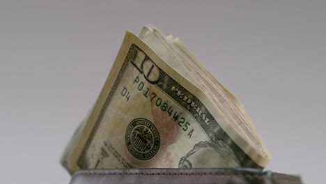 Money-inside-of-a-wallet-ten-dollar-bill