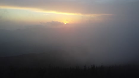 sunset-through-the-fog,-appalachian-mountains-and-blue-ridge-mountains-aerial