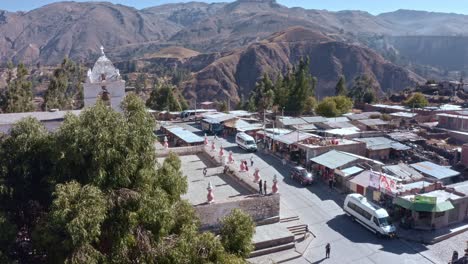 aerial-shot-of-maca-district,-next-to-its-temple