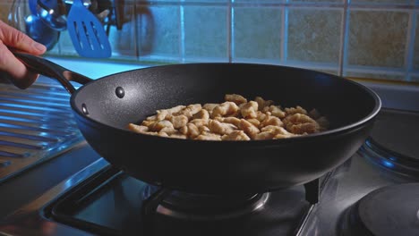 Tossing-Chicken-Breast-Pieces-Cooking-In-A-Pan