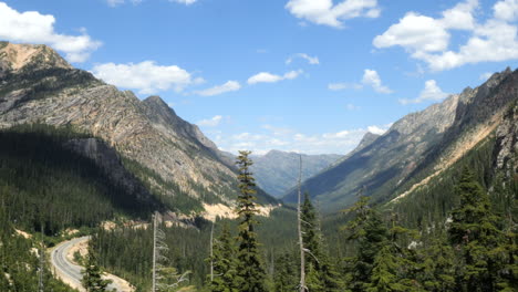 Rocky-Mountain-Pass-landscape-with-Pine-Trees-and-Road-Passing-Through