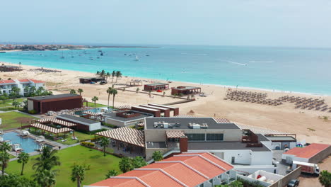 Aerial-Drone-view-of-luxury-beach-resort-in-Santa-Maria,-Sal---Cape-Verde