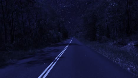 Rear-facing-night-driving-point-of-view-POV-for-interior-car-scene-green-screen-replacement---night-footage-under-a-clear-starry-sky,-on-quiet-deserted-country-roads-with-a-slight-righthand-bend