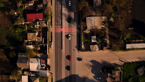 Aerial-Drone-Top-Down-Shot-Flying-Over-Highway-at-Golden-Hour