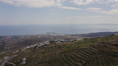 Aerial---Reveal-of-Tinos-behind-mountain