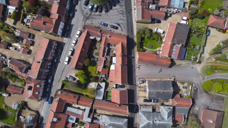 Topdown-Aerial-Drone-Shot-Flying-Over-Beautiful-Old-Burnham-Market-Village-on-Sunny-Day-in-North-Norfolk-UK
