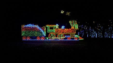 A-View-of-an-LED-Steam-Train-as-a-Christmas-Display-With-Moving-Wheels-and-Smoke
