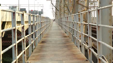 Old-metal-footbridge-over-the-river.-Bangkok,-Thailand