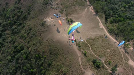 Paragliding-over-Hong-Kong-mountains-on-a-beautiful-clear-day,-Aerial-footage