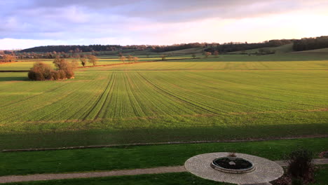 Leicestershire-Manor-House-view-over-field-during-day-diagonal-angle-zooming-in