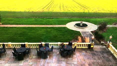 View-from-Leicestershire-Manor-House-overlooking-courtyard-with-alfresco-setting-and-green-paddocks-beyond