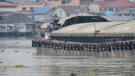 Large-Green-Barge-Boat-Moving-Down-A-Asian-River