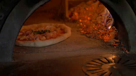 Pizza-baking-in-wooden-oven-part-2-from-3-4K