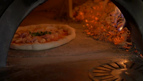 Pizza-baking-in-wooden-oven-part-2-from-3-HD