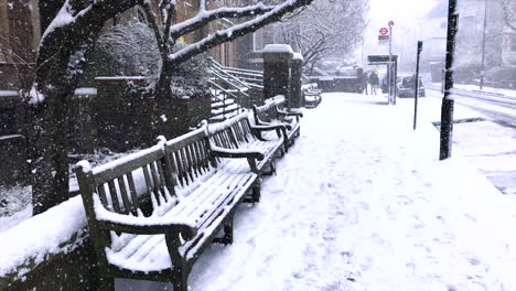 Snowy-London-city-scene-with-snowy-benches-at-a-Bus-Stop