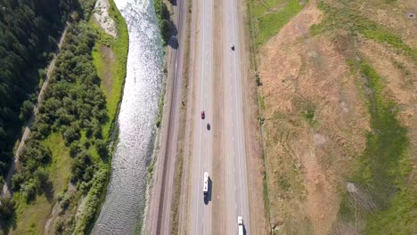Arial-footage-of-river-and-highway-running-side-by-side-on-USA's-westcoast