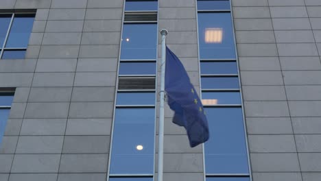 European-union-flag-with-skyscraper-on-background