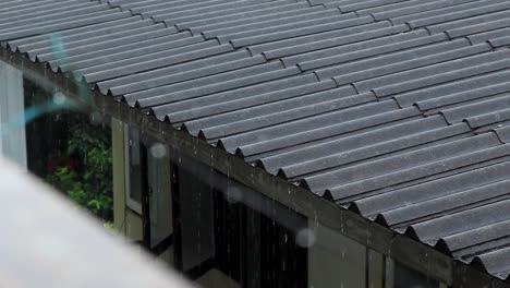 Rain-water-coming-down-pouring-down-from-the-roof-of-a-house