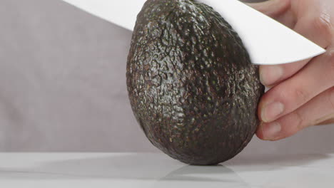 Cutting-an-avocado-in-half