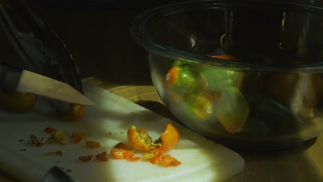 hands-cut-peppers-with-small-knife