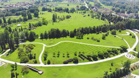 Aerial-Panorama-Over-The-Volcji-Potok-Arboretum-On-Sunny-Day