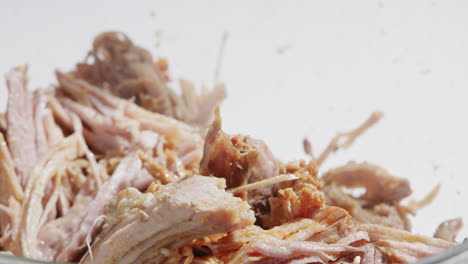 Mixing-shredded-pork-with-two-forks