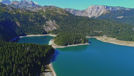 Aerial-of-spectacular-mountain-and-forest-landscape-in-glacial-Black-Lake,-Montenegro