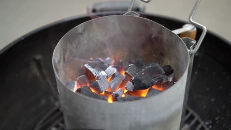 Burning-coals-on-a-BBQ-grill,-slow-motion