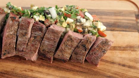 Juicy-medium-rare-flank-beef-with-vegetables,-slow-motion