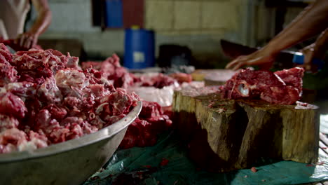 Filipino-Men-Butchering-and-Chopping-Pig-Meat-Into-a-Large-Bowl