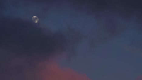 Dark-Colorful-Clouds-Billow-Across-Sky-With-Full-Moon
