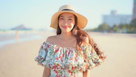 Romantic-portrait-of-Asian-girl-in-ethereal-dress,-summer-outfit,-on-beach