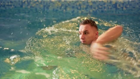 sports-guy-in-spa-swims-in-pool
