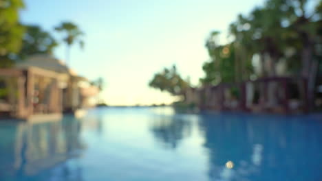 Blurred-view-of-empty-hotel-swimming-pool,-seamless-loop-background