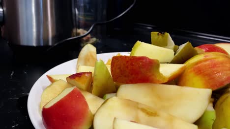 The-child-chooses-chopped-pieces-of-fruit-from-the-plate
