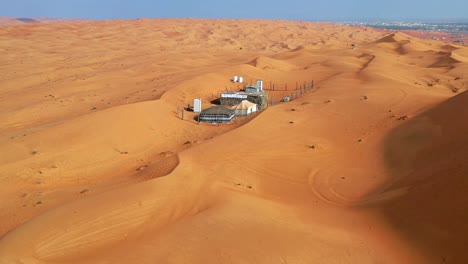A-drone-shot-of-a-tent,-campsite-in-the-desert,-Oman