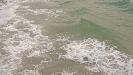 Green-sea-water-waves-foaming,-background-dynamic-movement