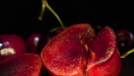 Cherries-cutted-in-half-macro-zoom-in-shot-surrounded-with-bunch-of-cherries