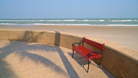 empty-bench-with-sea-beach-and-blue-sky-background