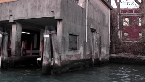 parked-boat’s-in-Venice-Italy,-filmed-from-a-boat