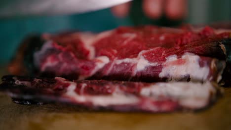 Close-up-view-of-Chef-slicing-the-steak-with-Steel-knife