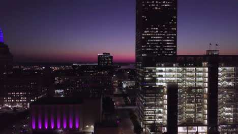 Tulsa-skyline-and-Arkansas-River-at-sunset-flyby-drone