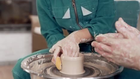 closeup-of-female-hands-on-a-pottery-wheel