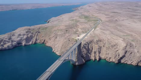 Aerial-shot-revealing-Pag-Island-Bridge,-Croatia