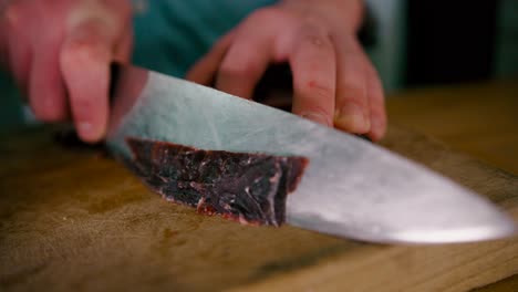 Chef-slicing-the-steak-with-Steel-knife