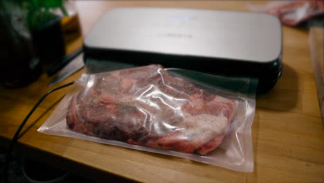 The-vacuum-packer-shrink-wraps-the-raw-meat-in-preparation-for-sous-vide-cooking