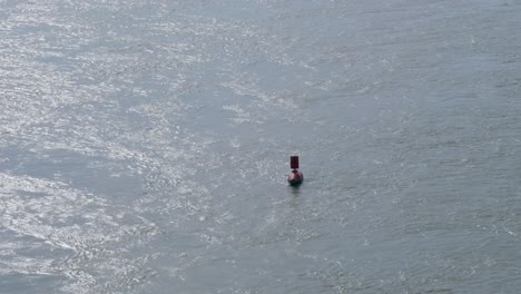 Red-buoy-in-the-Danube-river-,-Budapest,-Hungary
