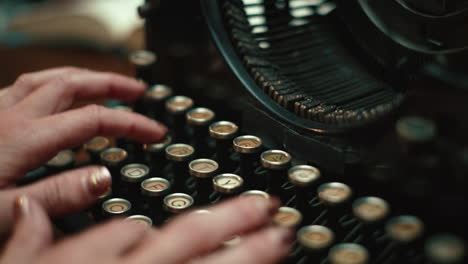 Woman's-hands-typing-on-an-isolate-vintage-underwood-typewriter