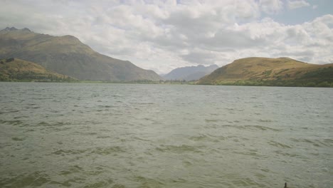 steady-shot-of-the-surface-of-lake-hayes-revealing-the-hills